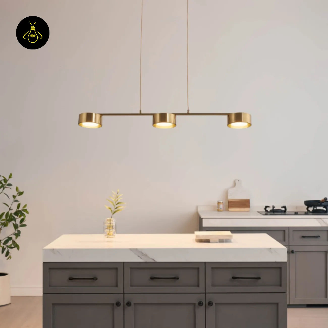 Linear Brass Chandelier – Triple Drum Spots, 108 cm | Jagmag Lights 6 Brass linear chandelier with integrated LED spots above a kitchen island – Jagmag Lights