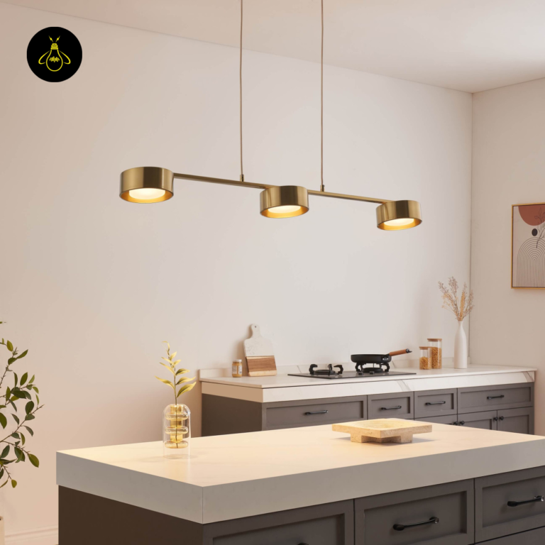 Brass triple-spot LED pendant light over a kitchen island