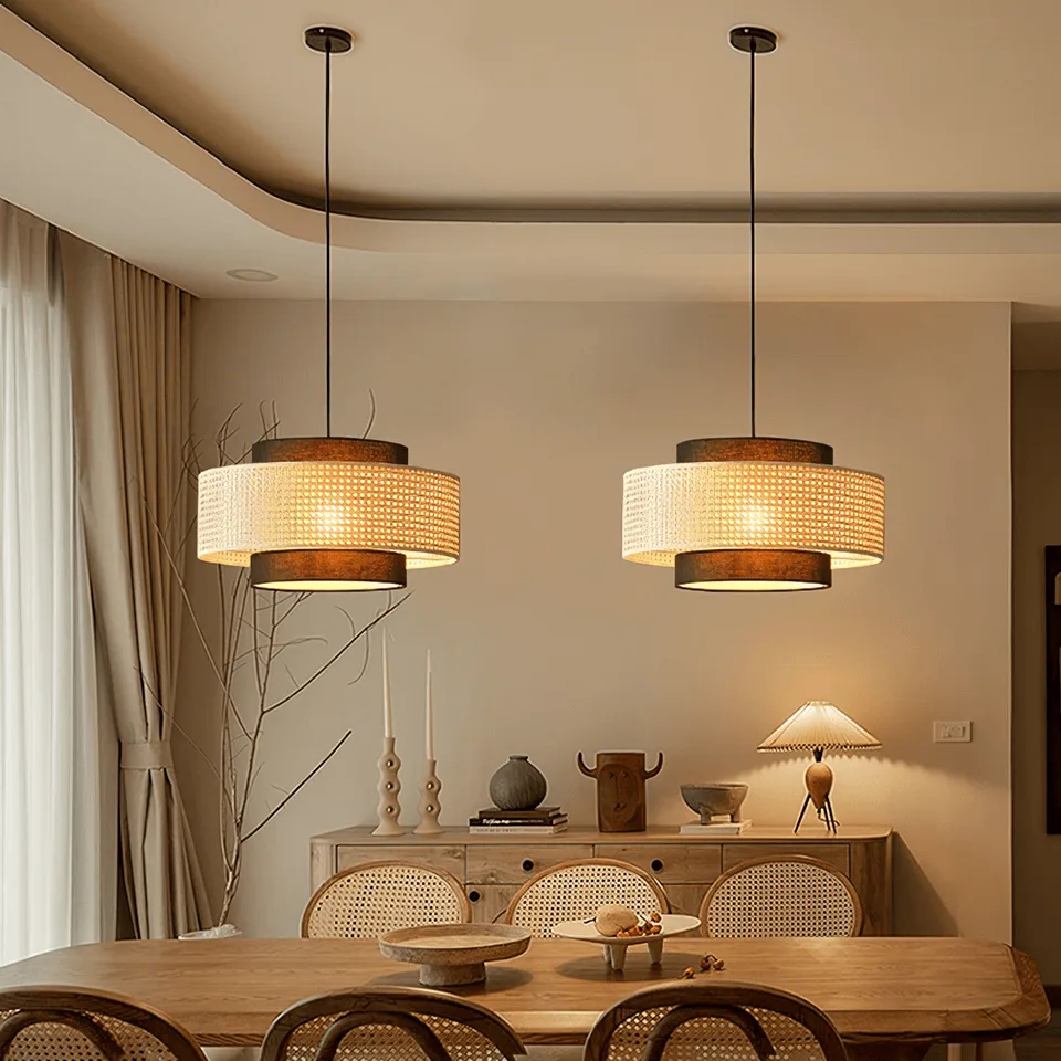 Japanese Rattan Pendant Light – Handwoven 40 cm Layered Drum, 2 Finishes 3 Rattan drum pendant light, angled view of the layered woven shade with dark trim bands
