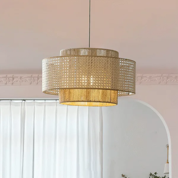 Japanese rattan pendant light, Japanese Concentric finish, lit in a room with white curtains and a cornice