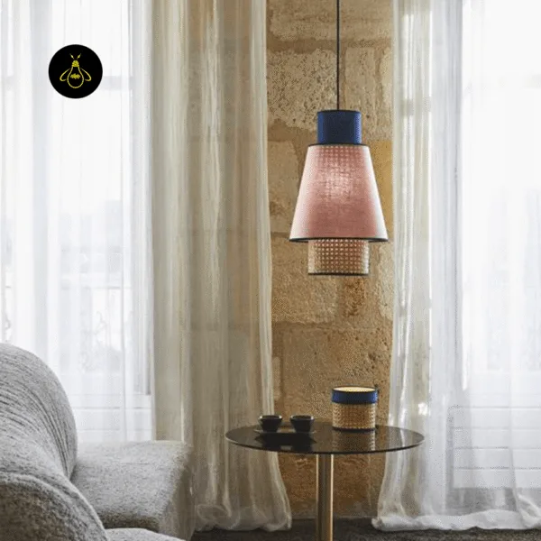 Floral fabric pendant light hung over a side table in a living room reading corner