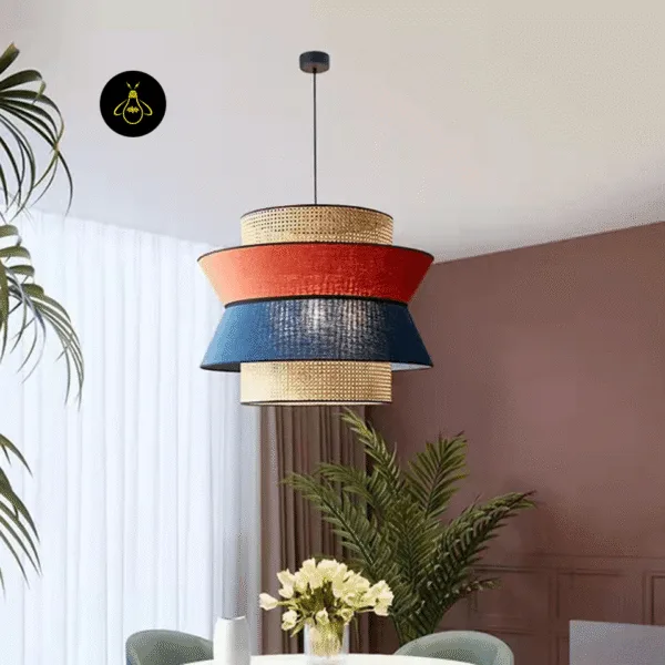 Layered rattan and fabric pendant light hanging over a dining table in a modern room