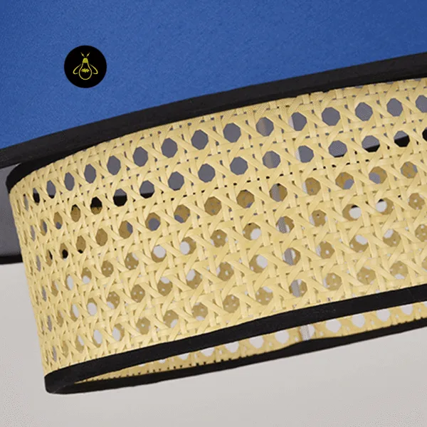 Close-up of woven rattan cane and linen fabric tiers on the rattan and fabric pendant light