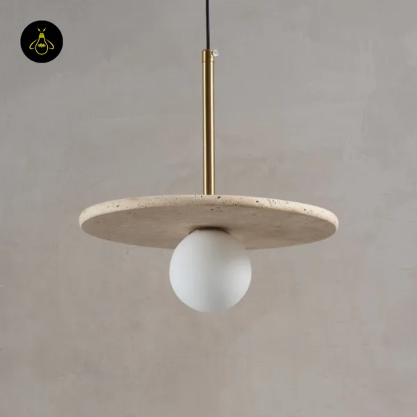 Stone pendant light switched off against a grey wall, showing the travertine disc and opal borosilicate glass globe
