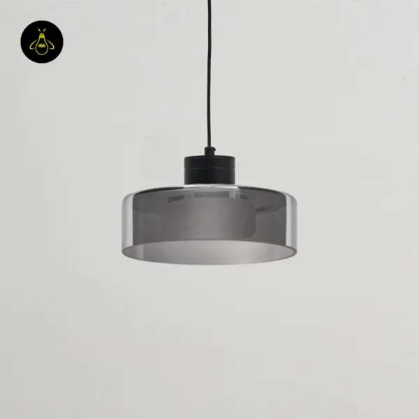 Smoked glass drum pendant light switched off, showing the grey borosilicate glass and black stainless steel cap
