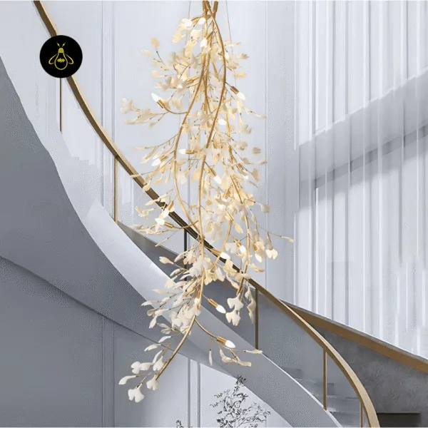 Ceramic leaf chandelier cascading over a curved staircase in a double-height living space