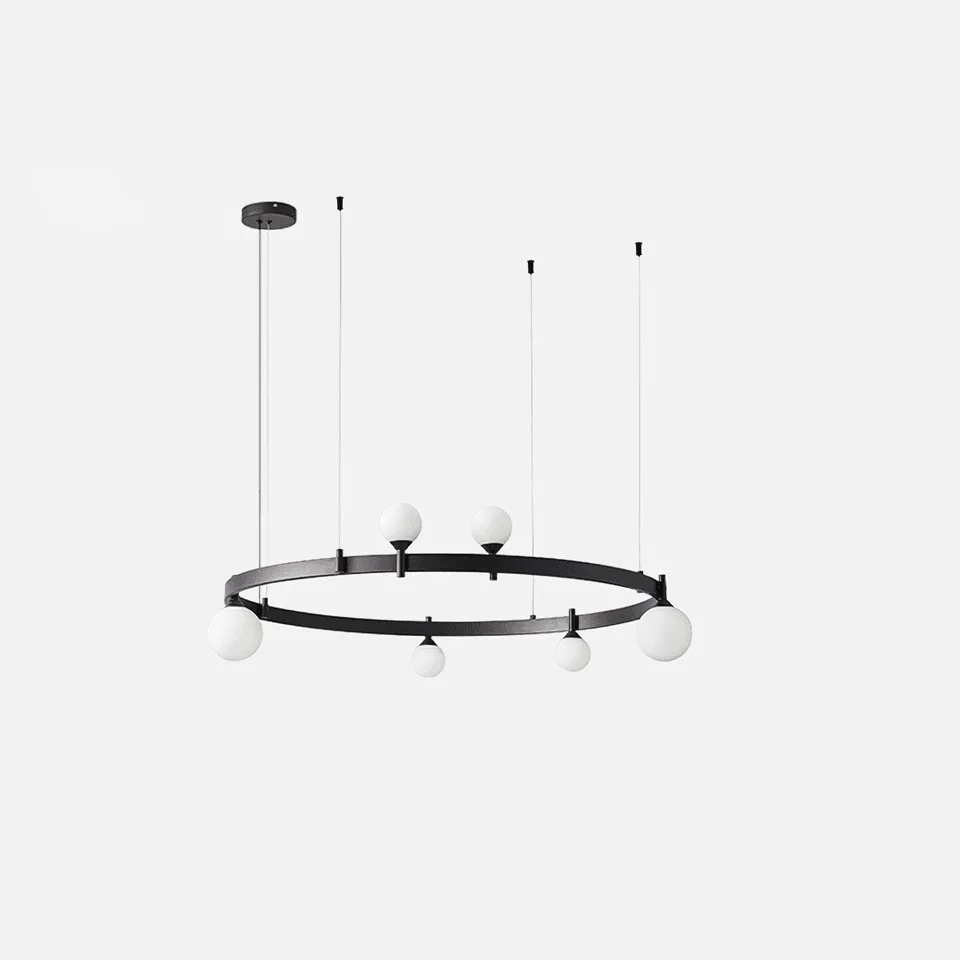 Modern glass chandelier with 6 opal-white glass globes on a black ring in a contemporary living room