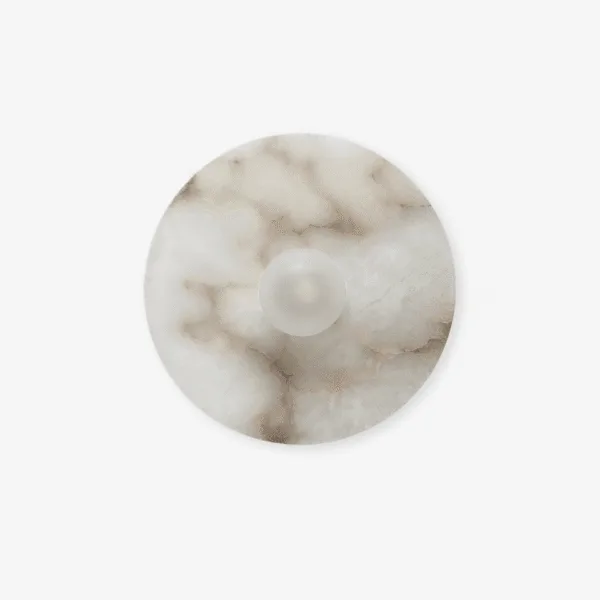 Alabaster disc wall light, front view of the round 35 cm white stone disc with grey veins and a small opal centre lens