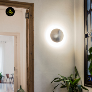 Round LED wall light in satin nickel on an office feature wall, contemporary decor