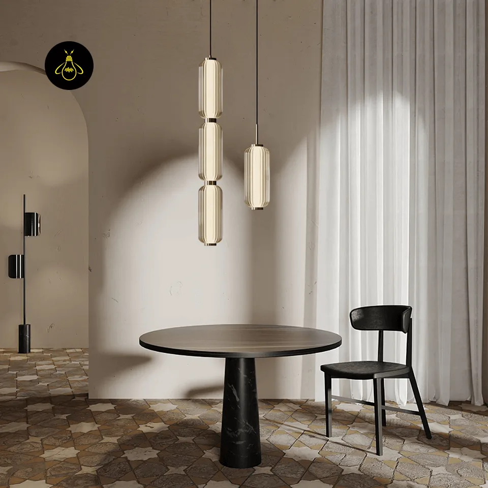 Linear Glass Pendant Light – Ribbed Gold Cylinder, 3 Sizes (31–94 cm) 8 Linear glass pendant lights installed over a round dining table in a styled room