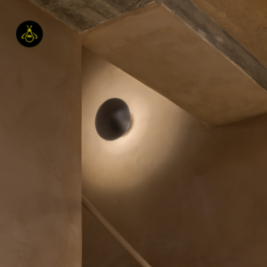 Close-up of the brushed satin nickel finish on the round LED wall light