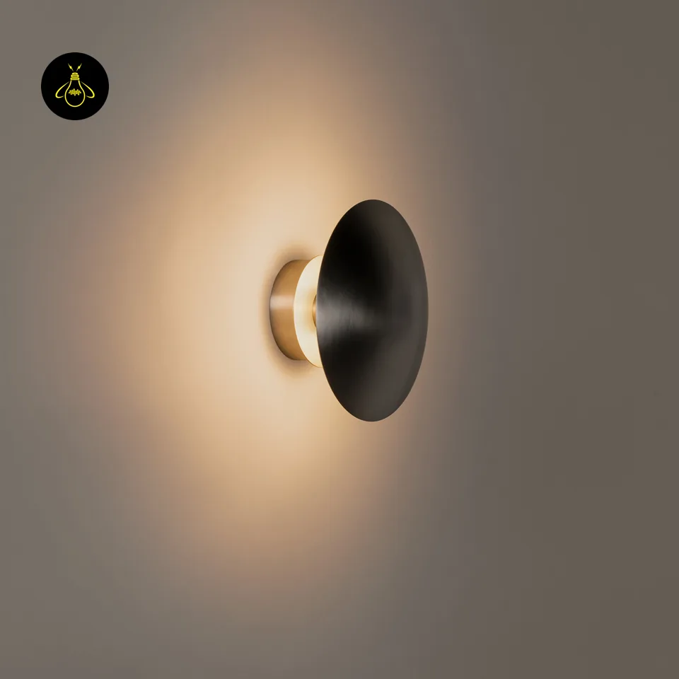 Round LED Wall Light – Satin Nickel Eclipse Disc, 24 cm Warm White Halo 3 LED wall light switched on, warm-white halo spreading behind the steel disc, side view