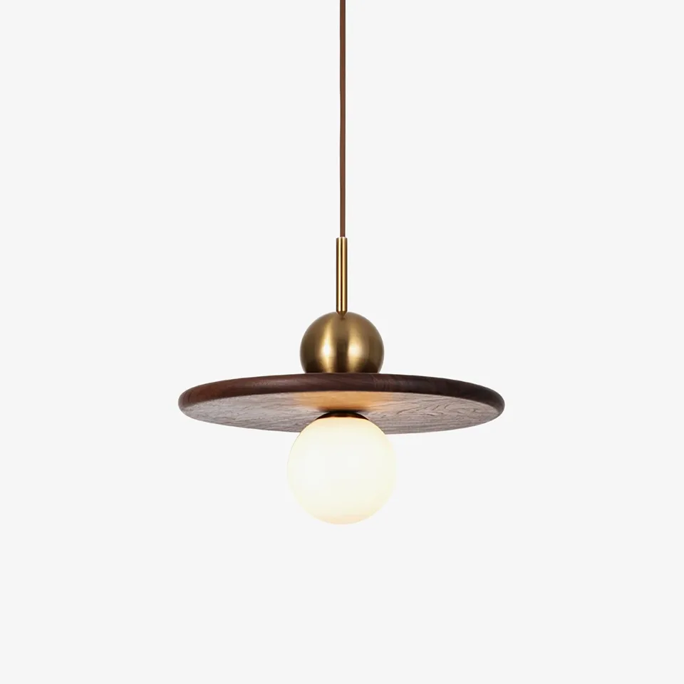 Wood and glass pendant light with a walnut disc, gold ball and white opal globe