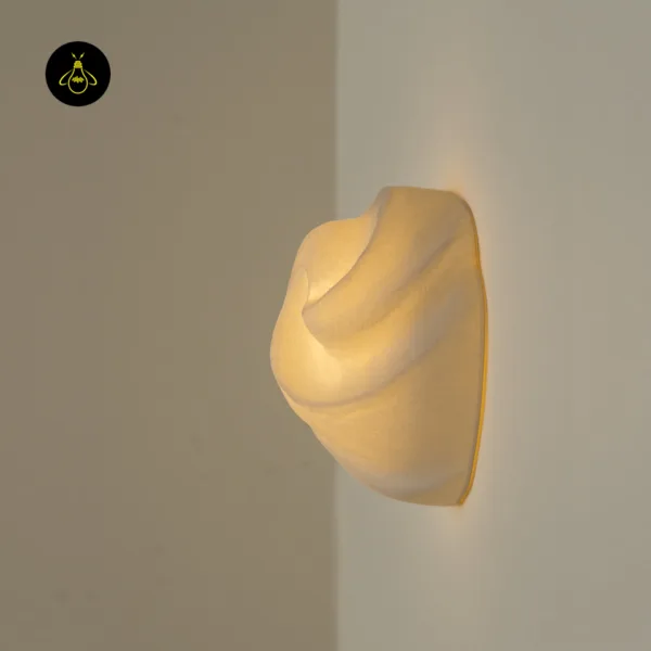 Alabaster sculptural wall light side profile, swirl shade 10.2 cm deep with warm light at the wall edge