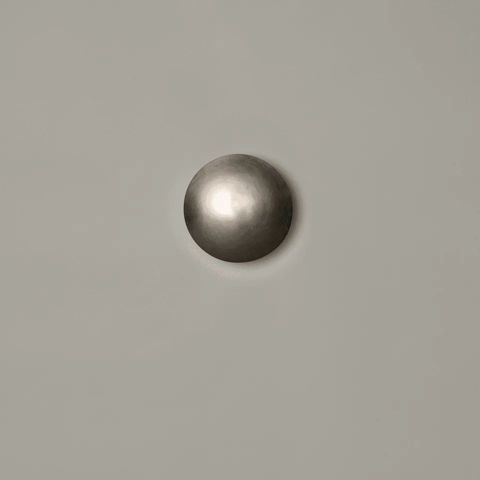 Front view of the round LED wall light, satin nickel stainless steel dome, switched off