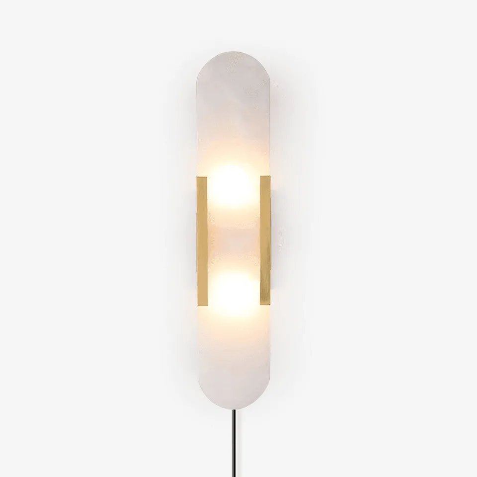 Linear alabaster wall light with brass frame and elongated capsule shade for living room