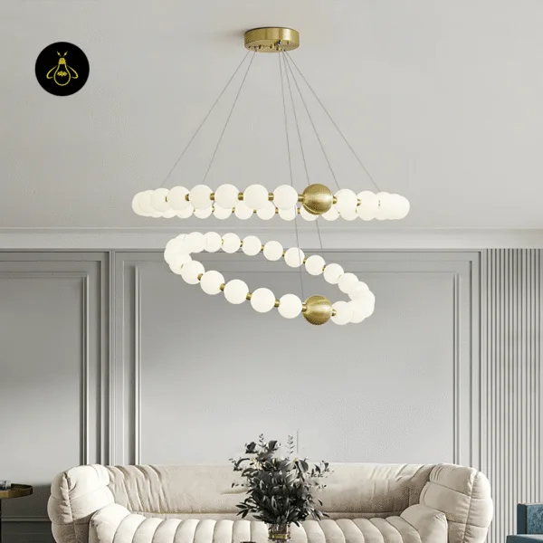 Pearl chandelier lighting a living room with a warm diffused glow over a sofa