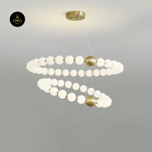 Acrylic pearl chandelier glowing against a dark background showing its glamorous two-tier design