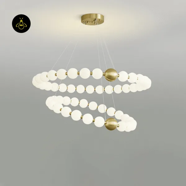 Pearl chandelier glowing against a dark background showing its glamorous two-tier design