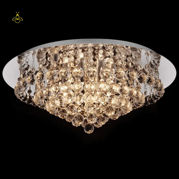 Round K9 crystal flush-mount chandelier glowing with warm light