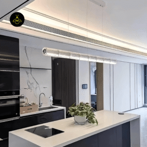 Linear segmented glass chandelier lighting a modern kitchen island with a warm LED glow