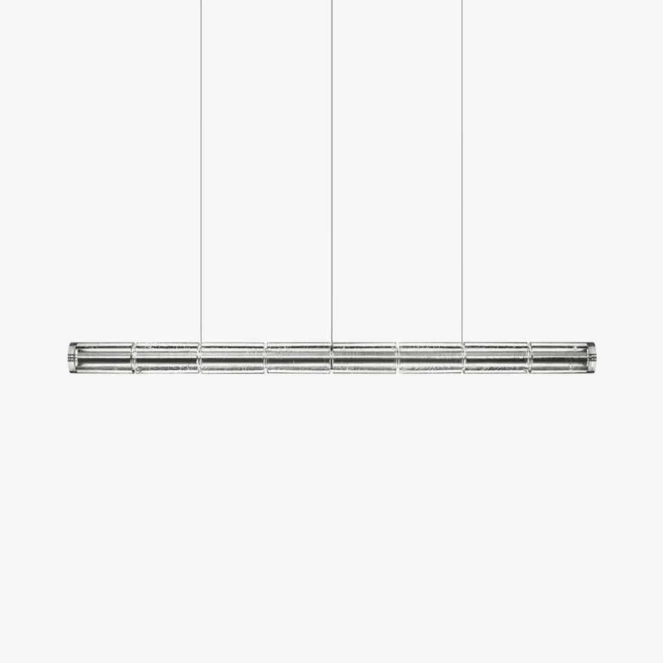 Linear LED chandelier with segmented clear glass and chrome finish for a dining table