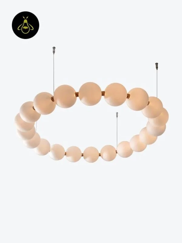 String pearl chandelier with milk-glass globes and brushed-brass connectors