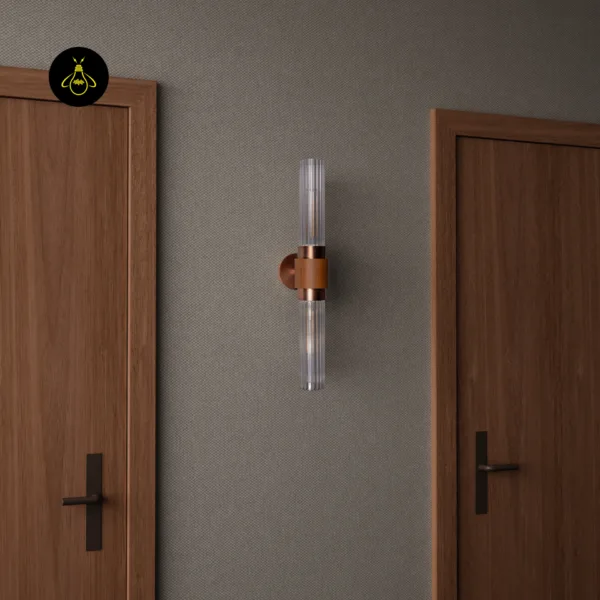 Fluted glass wall light mounted in a hallway between two wooden doors