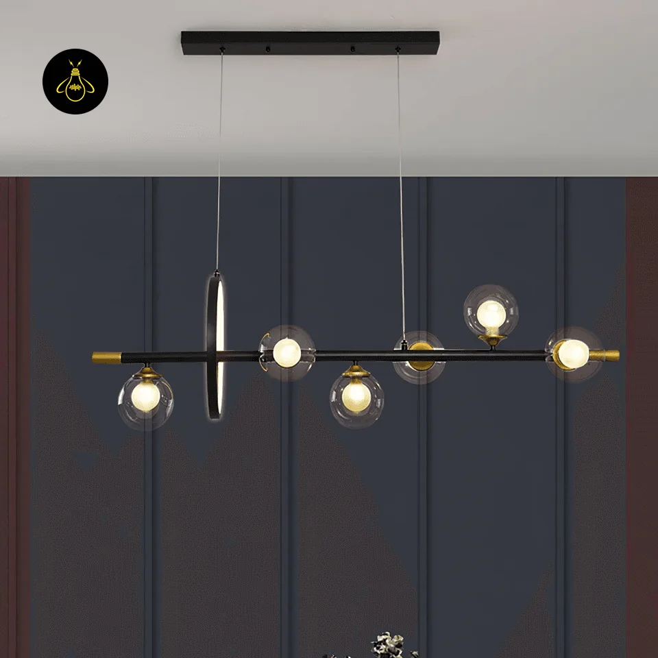 Dining Table Chandelier – 6-Globe Linear Glass & Brass Light with LED Ring, 120 cm 7 Linear dining chandelier with six clear borosilicate glass globes above a kitchen island