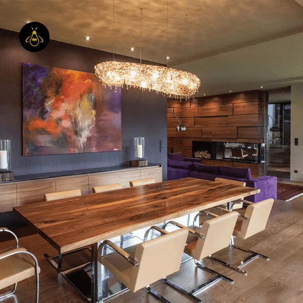 Crystal chandelier for dining room installed above a long walnut dining table