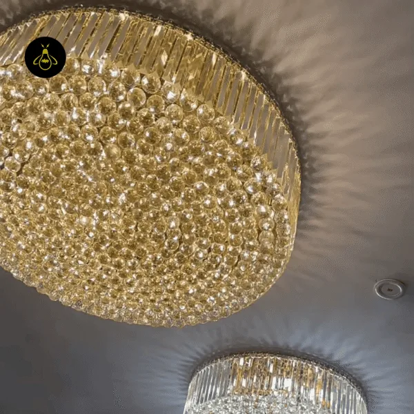 Gold crystal ceiling chandelier glowing warm with concealed E14 bulbs