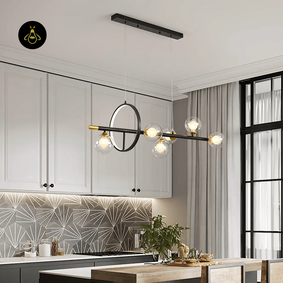 Dining Table Chandelier – 6-Globe Linear Glass & Brass Light with LED Ring, 120 cm 8 Six globe glass and brass dining table chandelier with warm G9 bulbs over a kitchen dining island