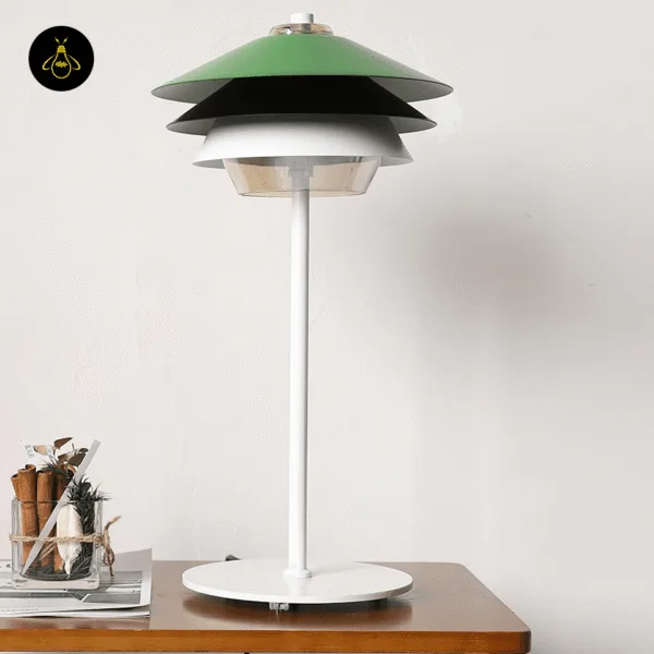 Close view of green overlay table lamp layered metal reflectors and clear borosilicate glass diffuser