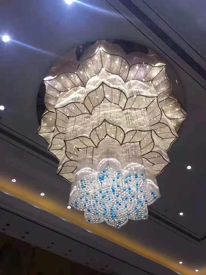 Lotus crystal chandelier with blue accent drops installed at Silver Oak Hotel and Banquet Kanyakumari