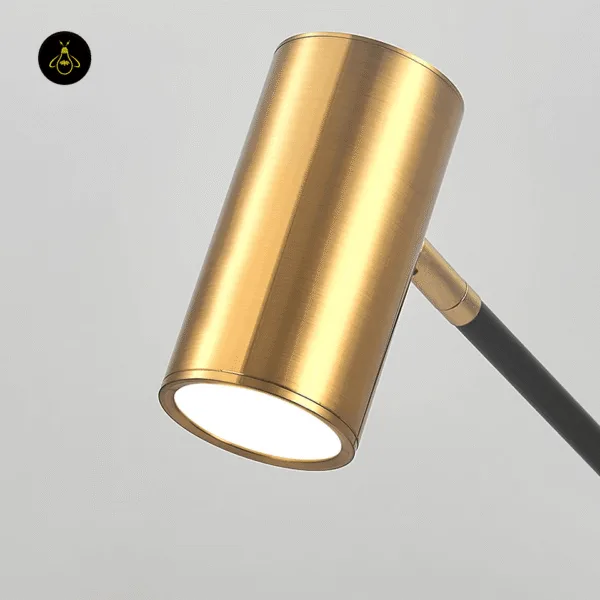 Close-up of the brushed brass cylinder spot head with frosted diffuser lens