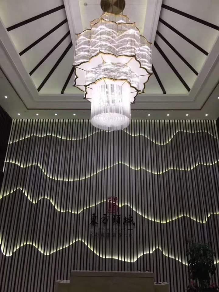 Tall lotus-inspired crystal chandelier installed in the lobby at Silver Oak Hotel and Banquet Kanyakumari