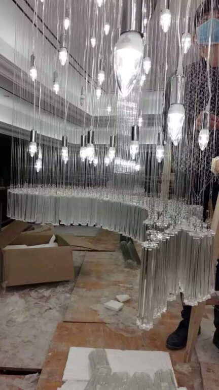 Pendant field and crystal fringe details within the Luxe Cascade banquet lighting project in Pune