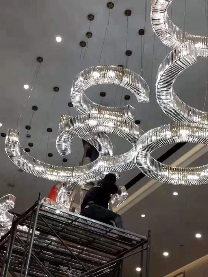 Crystal chandelier Indore: 16-foot custom script chandelier being installed at The Sapphire Estate
