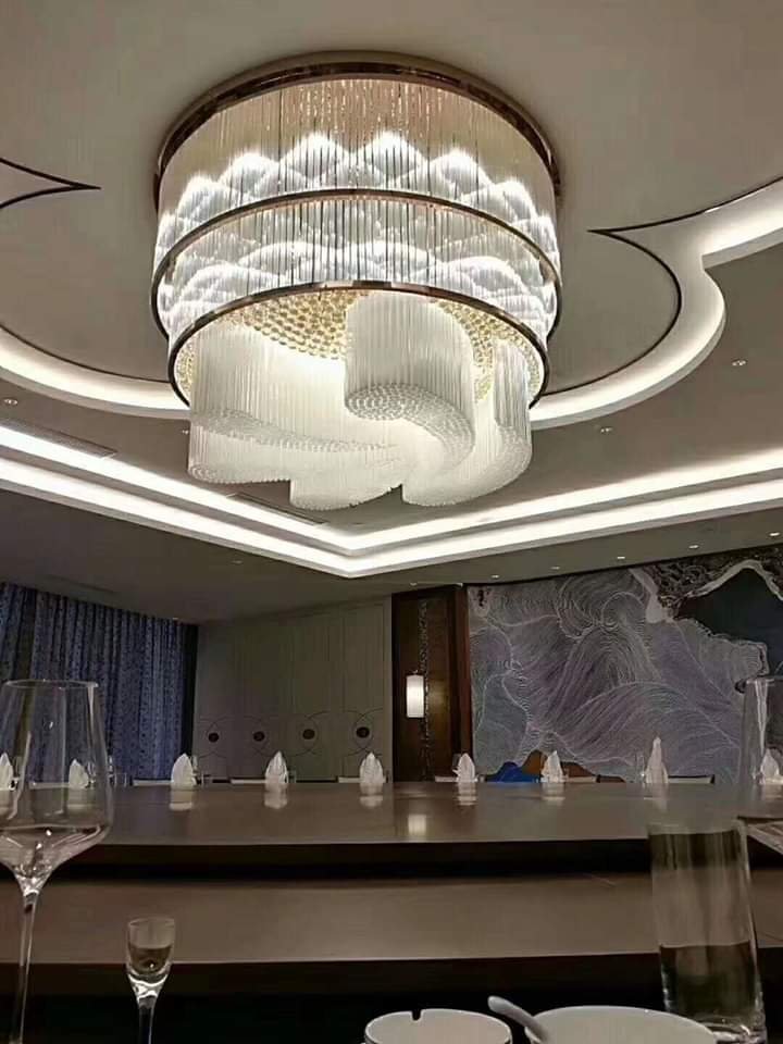 Circular crystal chandelier with spiral center installed at Bavdhan Palace Banquet Pune
