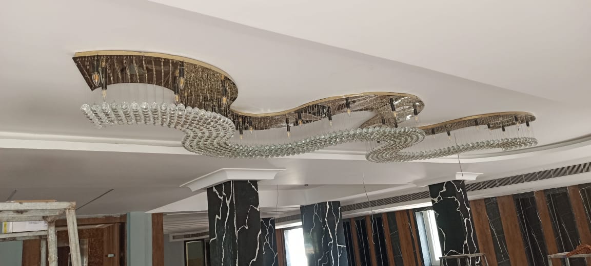 Close view of clear crystal rod detailing in the Visakhapatnam wave chandelier