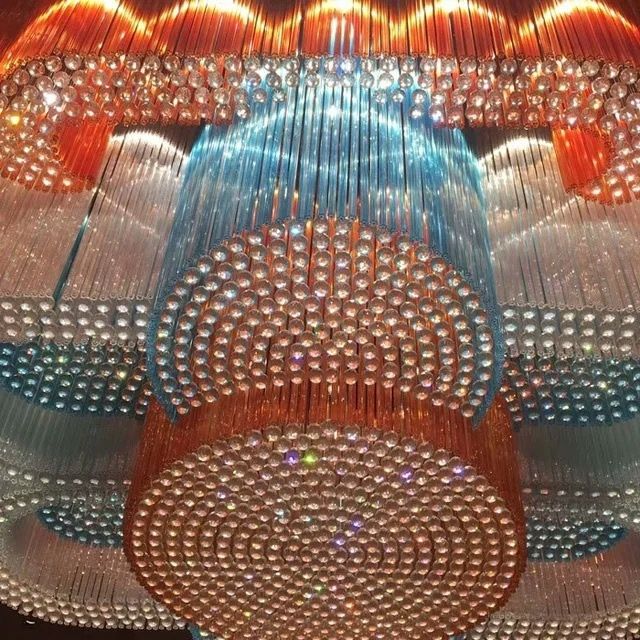 Multi-colored crystal chandelier with layered circular forms in the Bangalore project