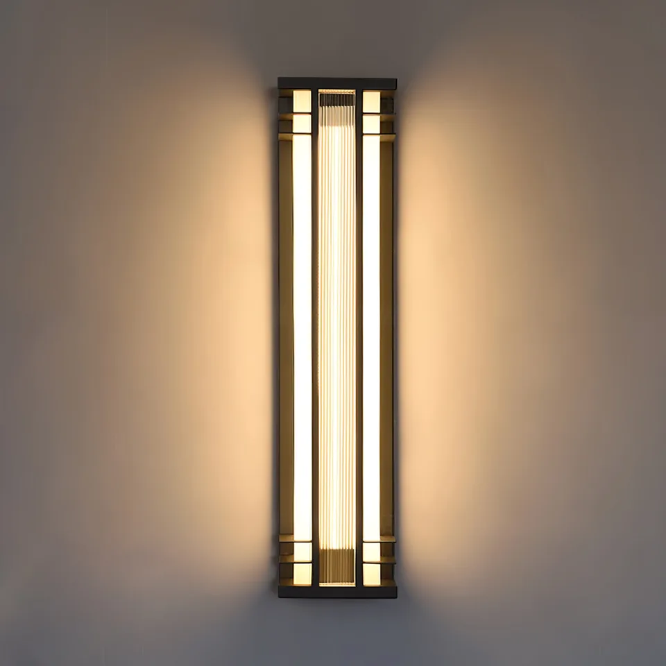 Outdoor Wall Sconce – 70 cm Tall Black & Brass IP65 LED Light 2 Outdoor wall sconce casting a warm up-and-down glow on a patio wall