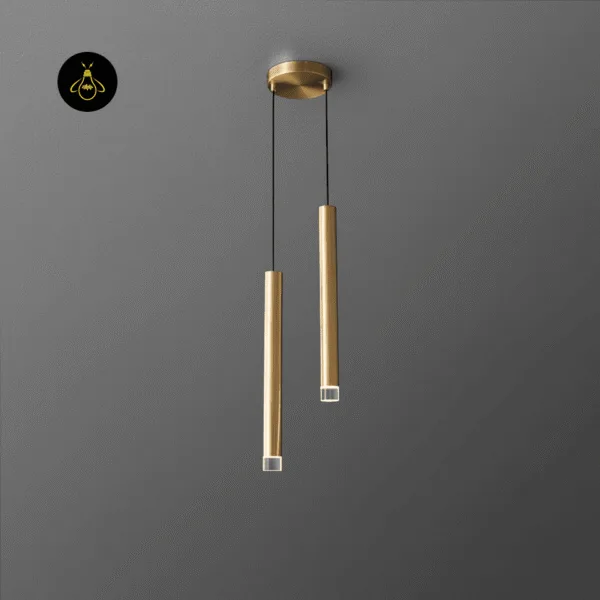 Gold pendant light with two slim cylinder LED rods hanging from a round brushed gold canopy against a grey ceiling