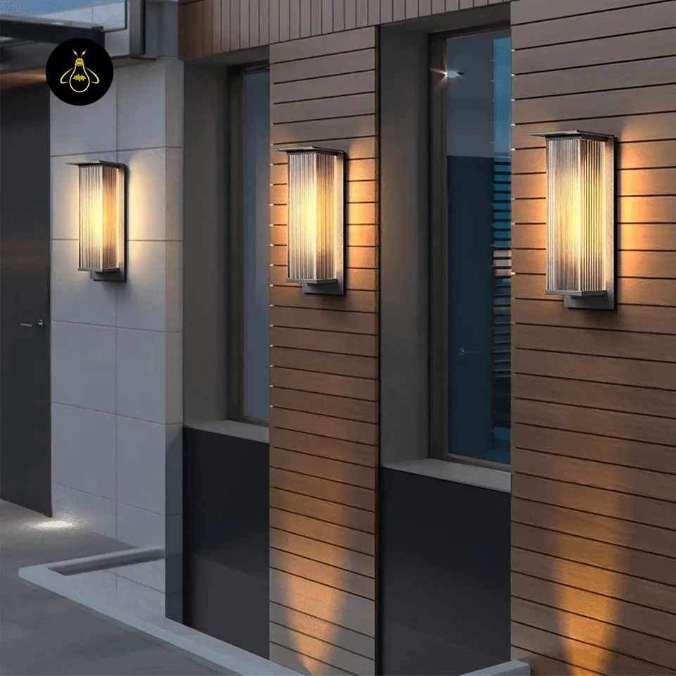 Modern Outdoor Wall Light - Premium 51 cm Oleron Sconce 5 Pair of modern outdoor wall lights framing a home entrance with warm IP65 glow