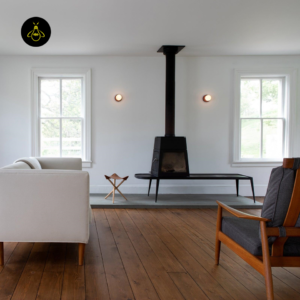 Pair of red globe wall lights flanking a fireplace in a living room