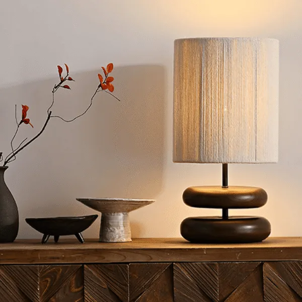 Wabi sabi table lamp with hemp rope shade styled in a modern rustic room