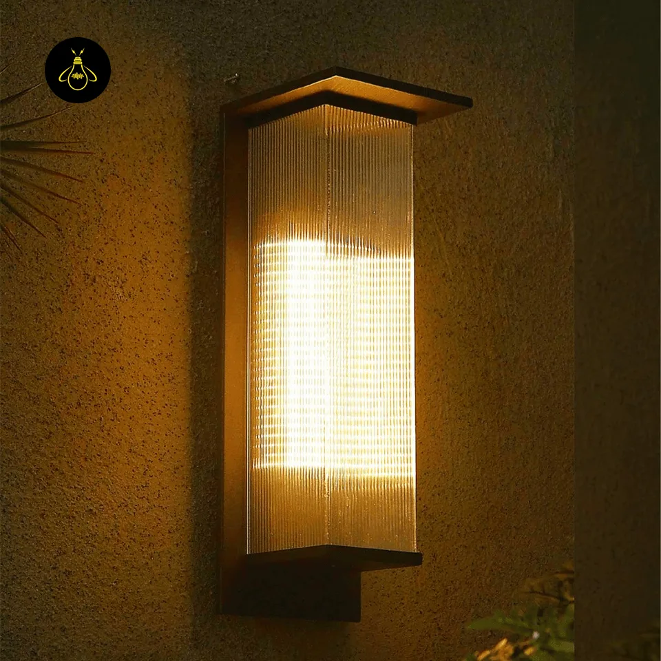 Modern Outdoor Wall Light - Premium 51 cm Oleron Sconce 8 Modern outdoor wall light glowing warm white on a textured patio wall at night