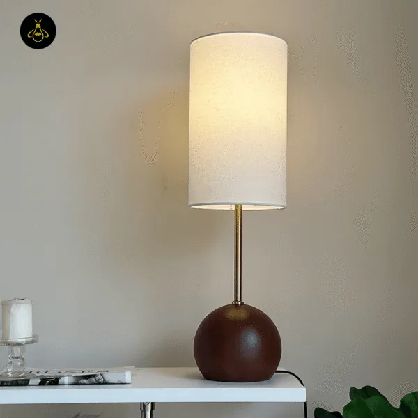 Wooden sphere table lamp lighting a cozy living room corner with a warm glow
