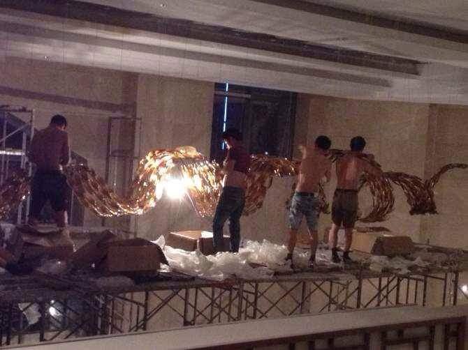 Golden ribbon chandelier installed at Crystal Crown Banquet Punjab