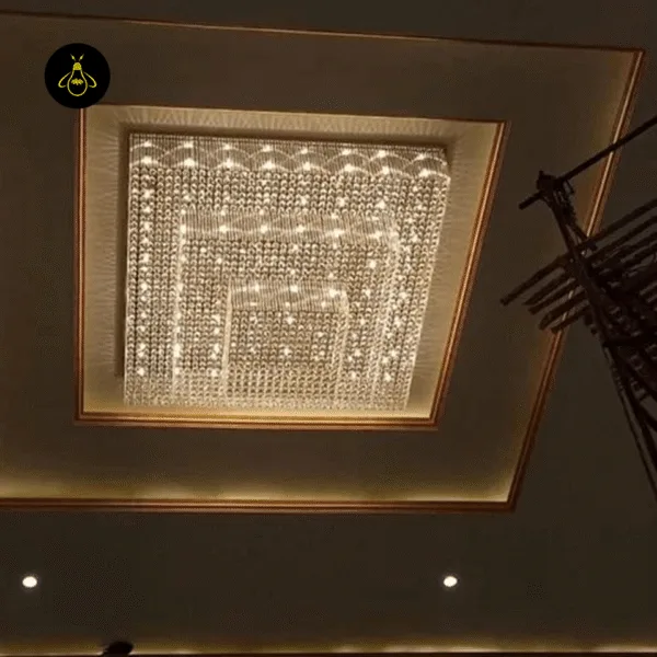 Crystal flush mount chandelier radiating light across a banquet hall